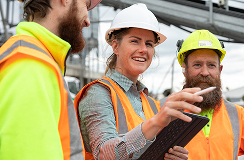 people in hard hats on a construction site